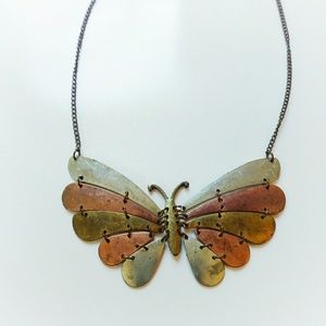 Metal butterfly necklace.